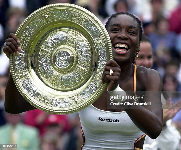 Venus Williams of the USA with the Wimbledon trophy after beating Lindsay Davenport of the USA during the final of the womens singles in the...