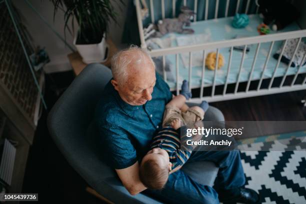 Guy Rocking A Baby 160 Man Rocking Baby Stock Photos, High-Res Pictures, and Images ...