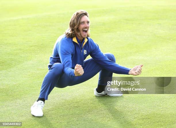Tommy Fleetwood of England and the European Team celebrates on the 18th green after Europe's 17.5-10.5 win over the United States during the singles...