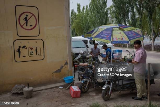 Do not urinate' sign seen on a wall in the Kashgar old Town, northwestern Xinjiang Uyghur Autonomous Region in China. Kashgar is located in the north...