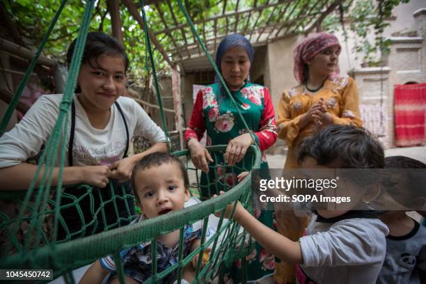 Traditional Uyghur family seen spending the afternoon together in the Kashgar old Town, northwestern Xinjiang Uyghur Autonomous Region in China....