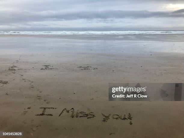 i miss you sign in the sand at the beach - i miss you stock pictures, royalty-free photos & images