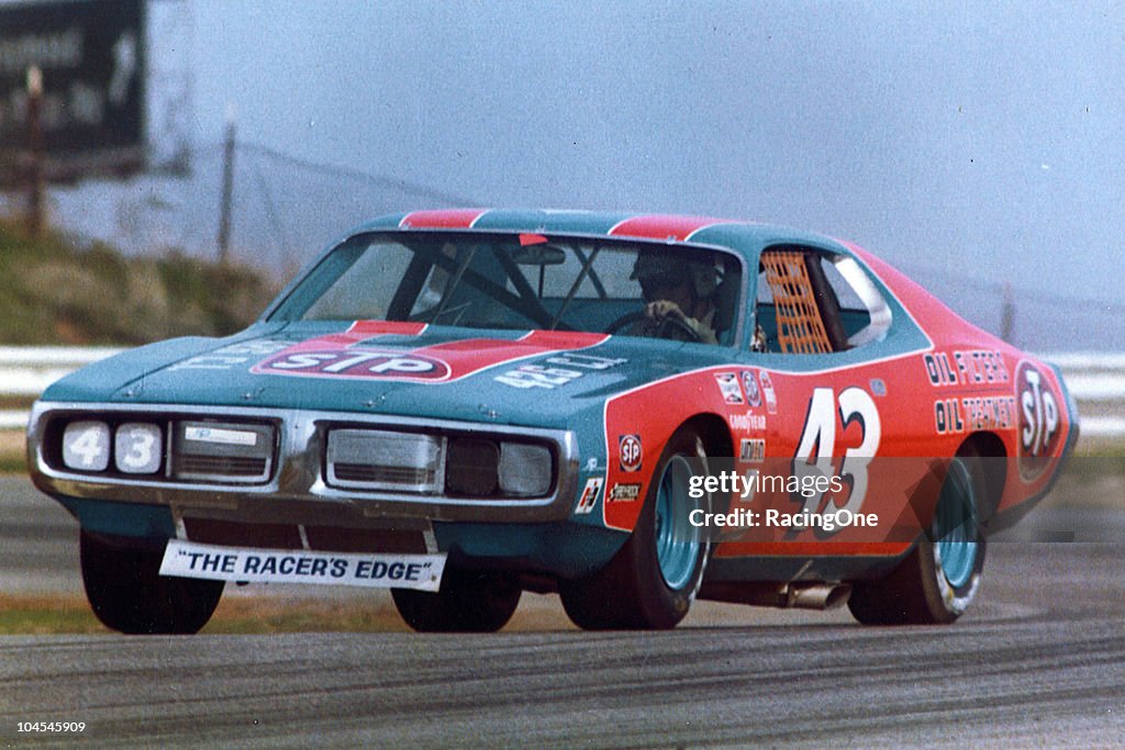 Stp Racing Richard Petty wheels his STP Dodge through a corner during a NASCAR ...