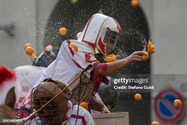 Detail of a member of an orange battle team takes part in the traditional 'battle of the oranges' during the Ivrea Carnival near Turin.