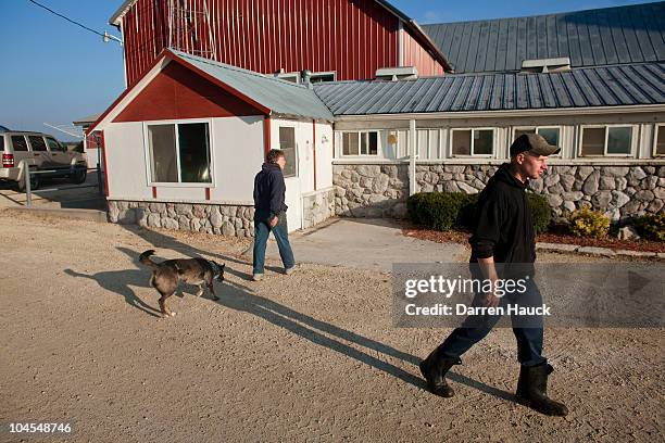 Rick Roden, continues on after talking with his mother Cindy Roden, at the the Rob-N-Cin farm on September 29, 2010 in West Bend, Wisconsin. The farm...