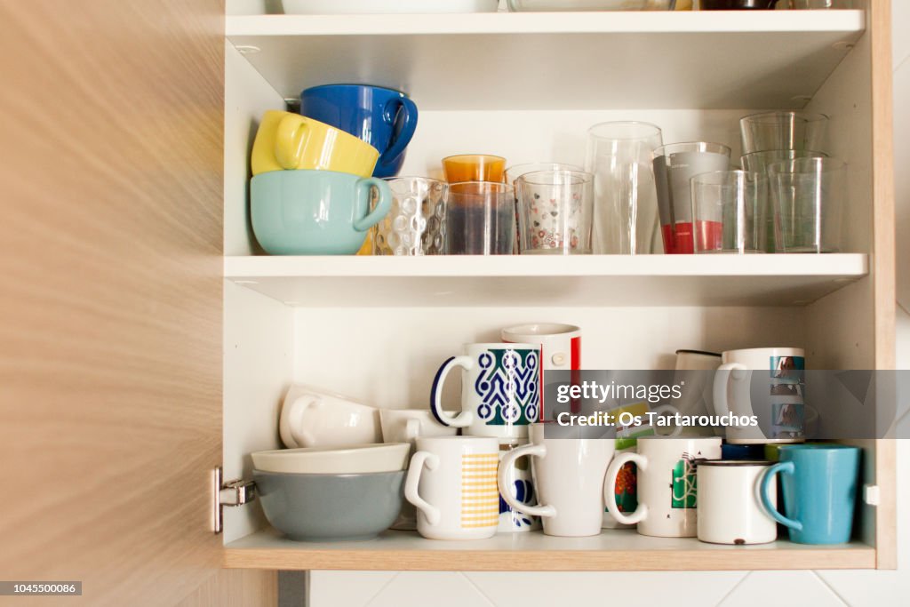 Kitchen cabinet with mugs and glasses
