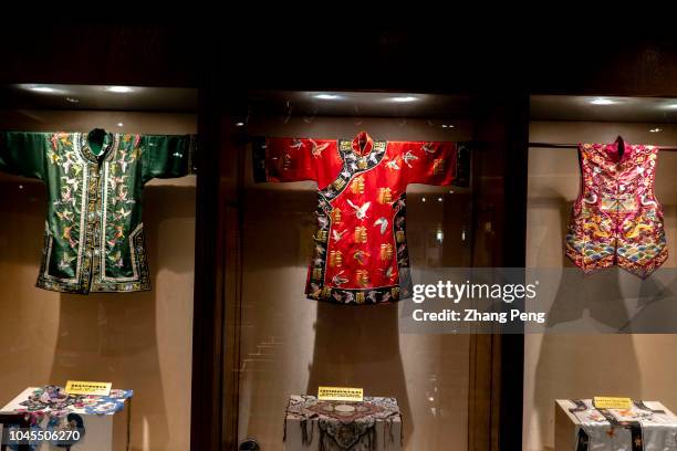 Traditional clothes made with Shu brocade. Shu brocade, specifically refers to the silk weaving jacquard brocade produced in ancient Sichuan area. It...