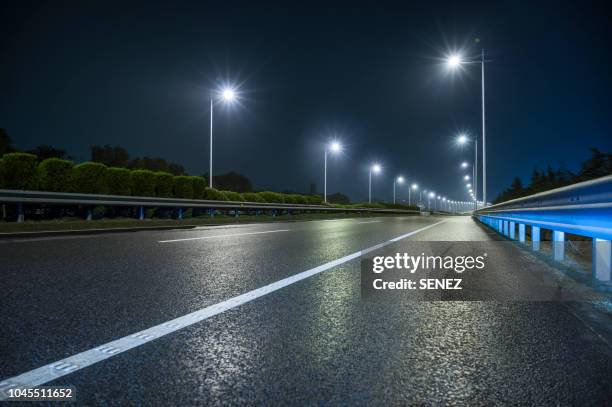 road background - wet asphalt stock pictures, royalty-free photos & images