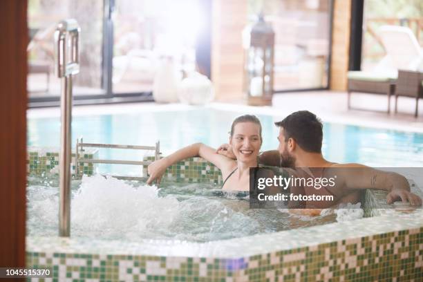 relaxing in a hotel hot tub - woman in hot tub stock pictures, royalty-free photos & images