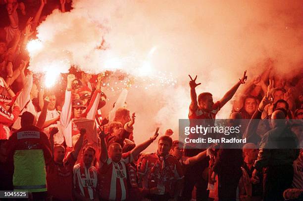 Belgrade fans celebrate with flares during the match between Leicester City and Red Star Belgrade in the UEFA Cup First Round First Leg at Filbert...