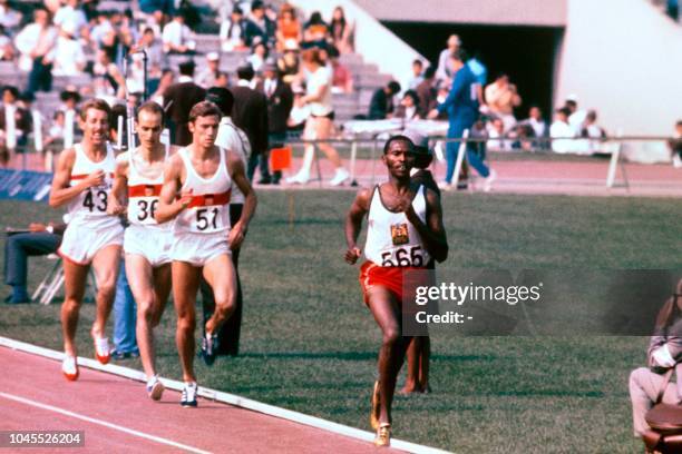 Competitors run during the men's 1500m final on October 20 during the Mexico 1968 Olympic Games. From R to L : Kenyan gold medal winner Kip Keino,...