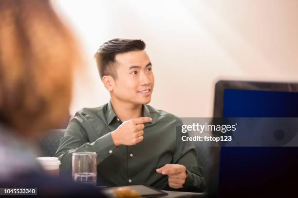 business man signing during team meeting. - american sign language stock pictures, royalty-free photos & images