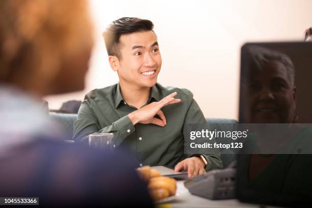 business man signing during team meeting. - deaf signing stock pictures, royalty-free photos & images