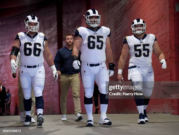 Austin Blythe, John Sullivan and Brian Allen of the Los Angeles Rams head to the field before the game against the Arizona Cardinalsat Los Angeles...