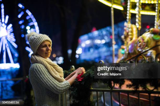 young woman next to the flying horses. - christmas norway stock pictures, royalty-free photos & images