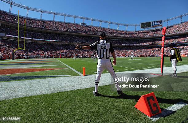 Side judge Jimmy DeBell oversees the action between the Denver Broncos and the Indianapolis Colts at INVESCO Field at Mile High on September 26, 2010...