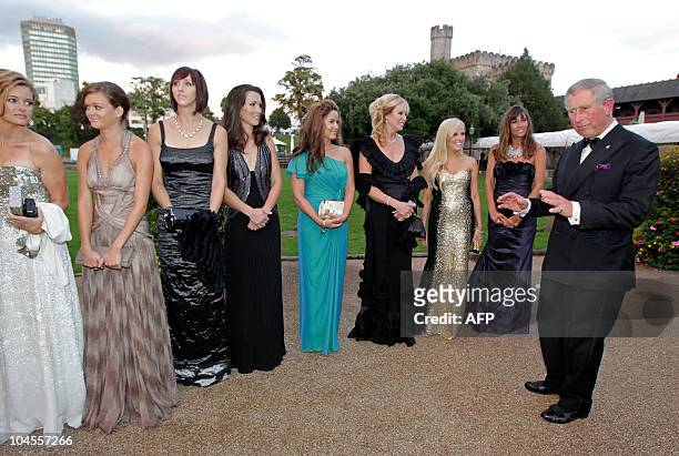 Britain's Prince Charles , meets the wives and girlfriends of the American Ryder Cup players, before the "Welcome to Wales 2010 Ryder Cup" dinner at...