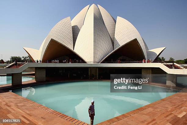 Tourists viste the Lotus Temple on September 30, 2010 in Delhi, India.