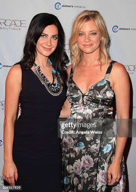 Owner of ARCADE Boutique Rochelle Gores Fredston and actress Amy Smart arrive at ARCADE Boutique's 'The Autumn Party' benefiting Children's...