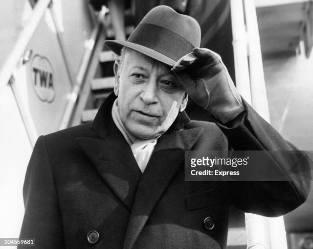 American actor George Raft arriving at London airport, England, on March 7, 1962.