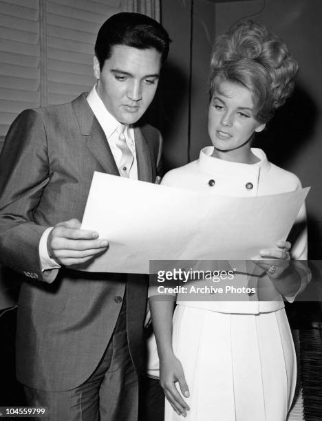 American actor and singer Elvis Presley with Swedish born American actress and singer Ann Margret at MGM studios rehearsing lines for the film 'Viva...