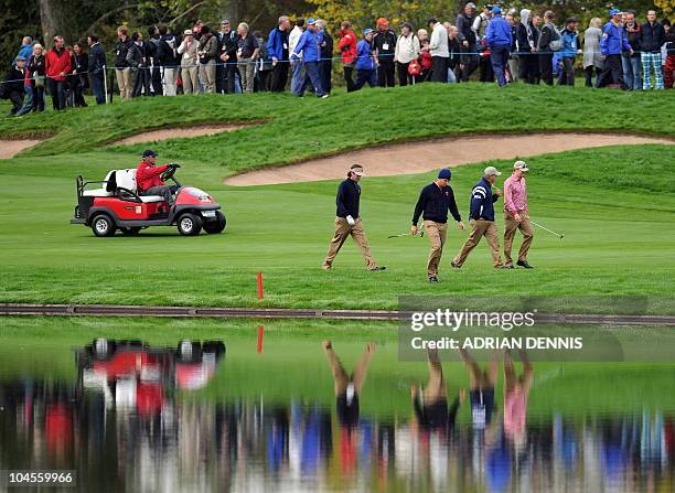 Ryder Cup player Bubba Watson and team mate Jeff Overton walk together during a practice session at Celtic Manor golf course in Newport, Wales on...