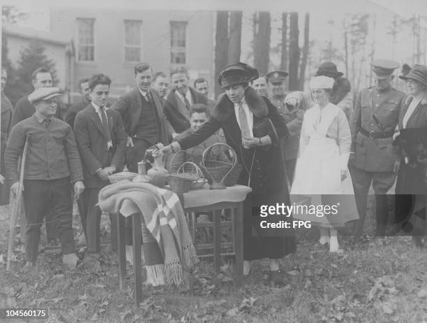 Grace Coolidge , First Lady of the United States, making a selection of Christmas gifts made by World War One veterans at the Walter Reed Army...