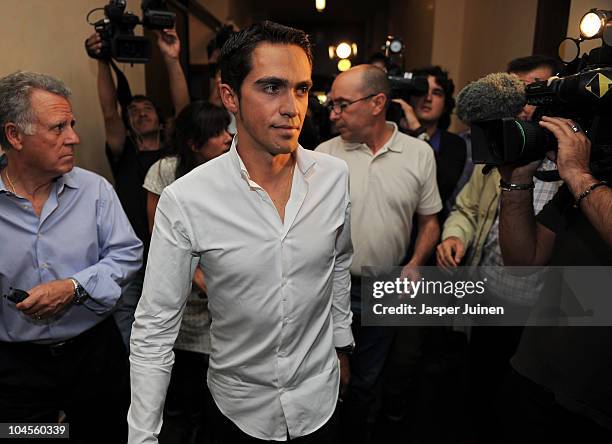 Alberto Contador is surrounded by media at the end of his press conference where he pleaded his innocence after being tested positive for...