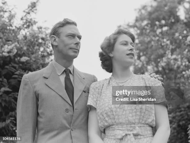 King George VI and Queen Elizabeth in the gardens at Windsor Castle, England, 8th July 1946.