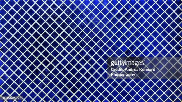blue mosaic wall tiles in a diagonal pattern - blue mosaic stock pictures, royalty-free photos & images