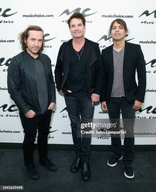 Jerry Becker, Patrick Monahan and Luis Maldonado of the Train visit Music Choice on October 4, 2018 in New York, United States.