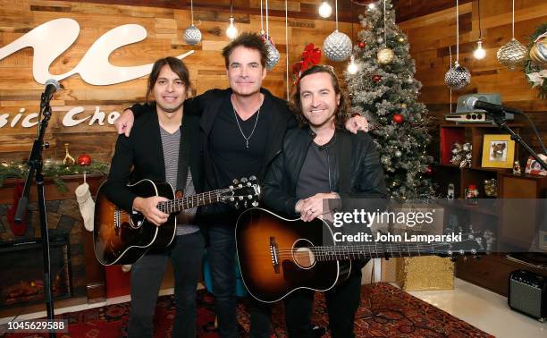 Luis Maldonado, Patrick Monahan and Jerry Becker of the Train visit Music Choice on October 4, 2018 in New York, United States.