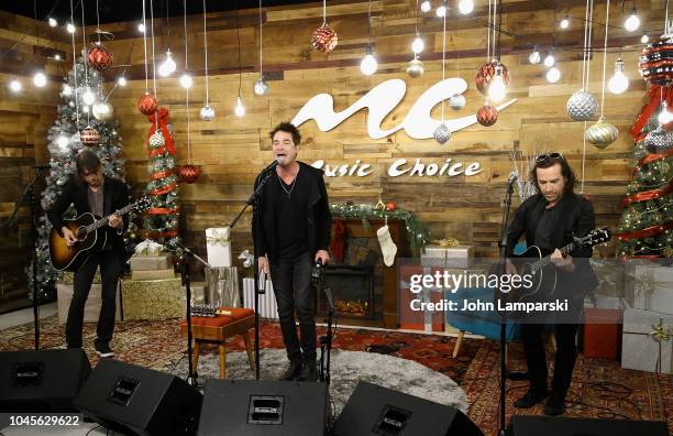 Luis Maldonado, Patrick Monahan and Jerry Becker of the Train perform at Music Choice on October 4, 2018 in New York, United States.