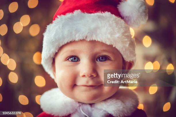 cute baby boy in christmas - santa face stock pictures, royalty-free photos & images