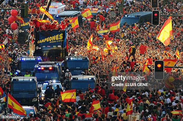 Spanish players parade through the streets of Madrid on July 12 a day after winning the World Cup for the first time 1-0 against Holland. Over one...