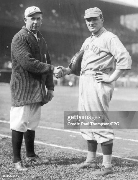 Boston Red Sox manager Bill Carrigan and Phillies manager Pat Moran shake hands circa 1920.