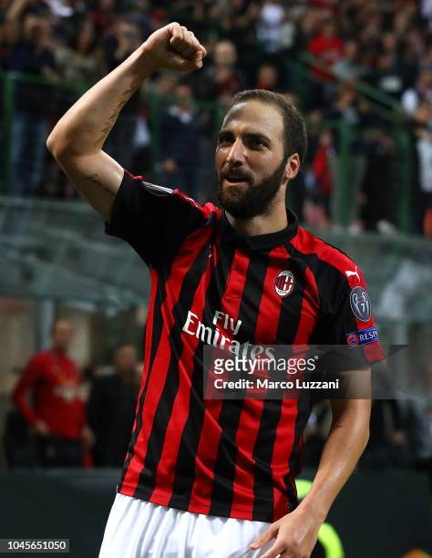 Gonzalo Higuain of AC Milan celebrates his goal during the UEFA Europa League Group F match between AC Milan and Olympiacos at Stadio Giuseppe Meazza...