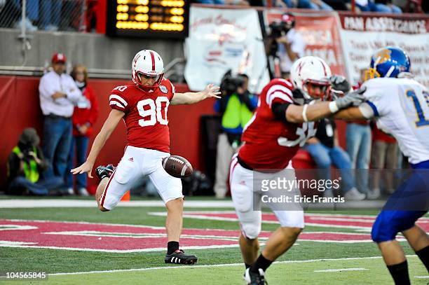 Nebraska Cornhuskers kicker Alex Henery punts the ball away during first half action of their game at Memorial Stadium on September 25, 2010 in...