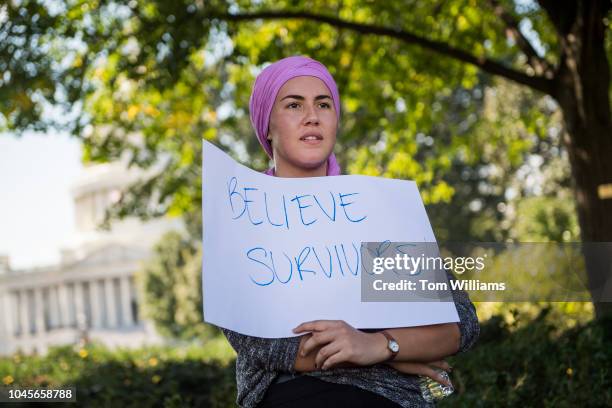 Protester opposed to Supreme Court nominee Brett Kavanaugh attends a rally at the Supreme Court after a march on October 4, 2018.