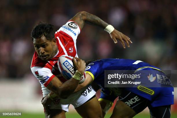 Ben Barba of St Helens is tackled by Tyrone Roberts of Warrington Wolves during the BetFred Super League semi final match between St Helens and...