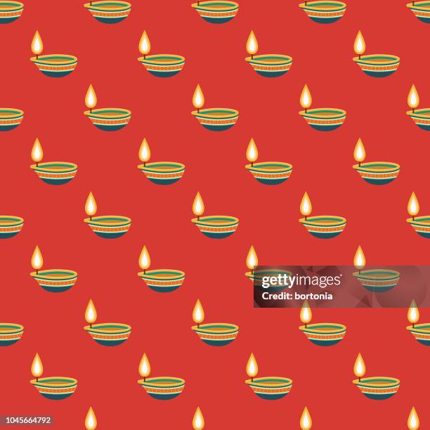 diwali candle india seamless pattern - diwali vector stock illustrations