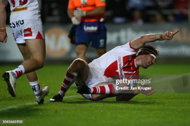 Luke Douglas of St Helens celebrates scoring the first try during the BetFred Super League semi final match between St Helens and Warrington Wolves...