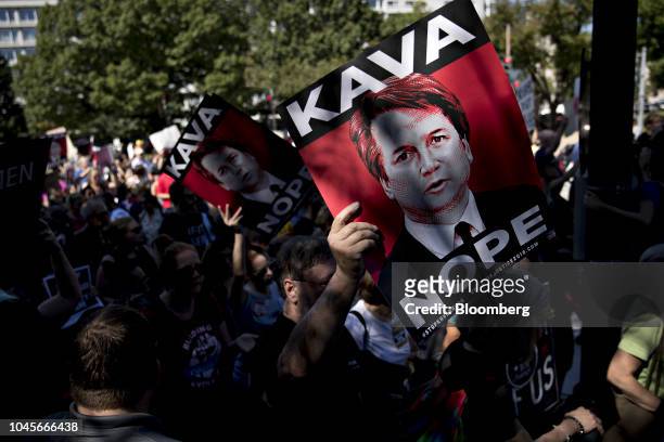 Protester opposed to Supreme Court nominee Brett Kavanaugh holds a "Kava Nope" sign while marching toward the U.S. Supreme Court in Washington, D.C.,...