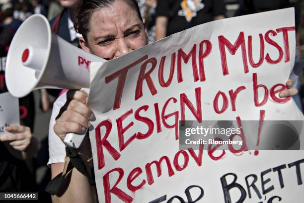 Protester opposed to Supreme Court nominee Brett Kavanaugh chants in a megaphone while marching toward the U.S. Supreme Court in Washington, D.C.,...