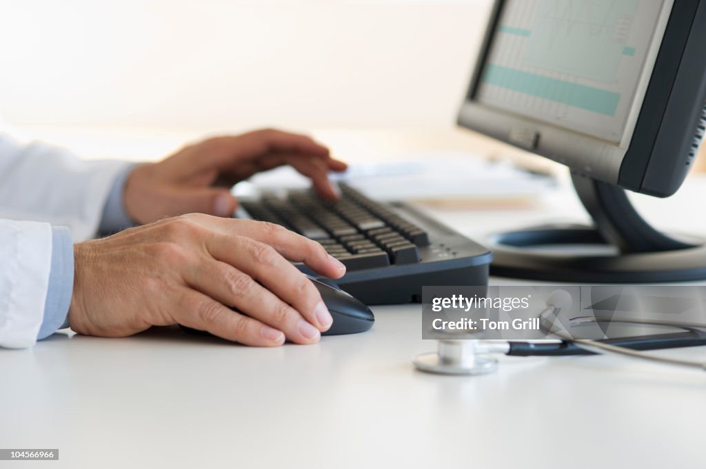 Hands using computer