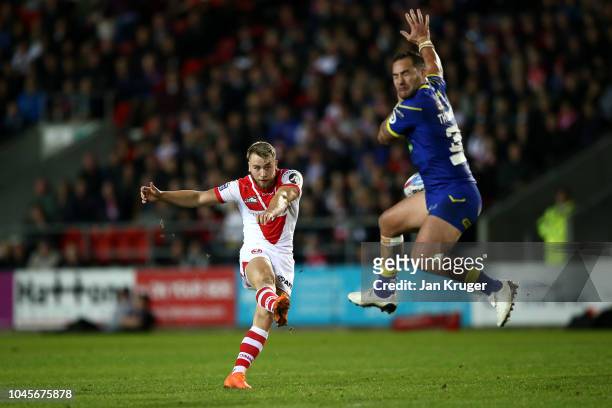 Danny Richardson of St Helens takes a drop kick to level scores during the BetFred Super League semi final match between St Helens and Warrington...