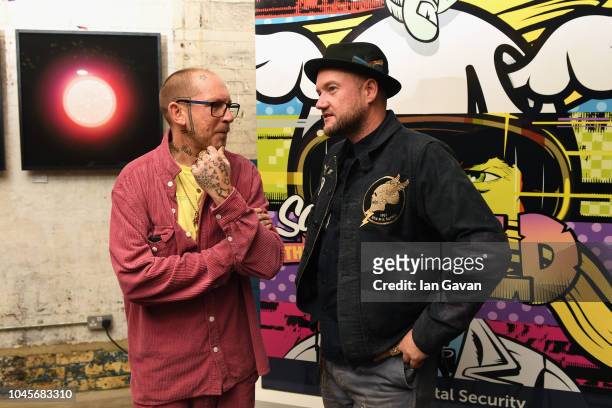 Artists Ben Eine and D*Face attend the unveiling of the first-ever Formula art car by Kaspersky Lab and street artist D*Face at Moniker Art Fair in...