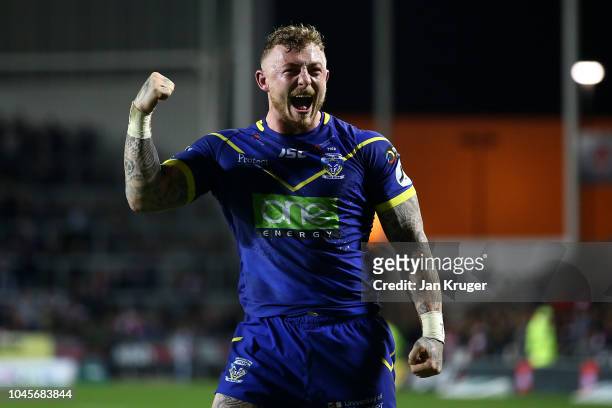 Josh Charnleof Warrington Wolves celebrate the win during the BetFred Super League semi final match between St Helens and Warrington Wolves at...