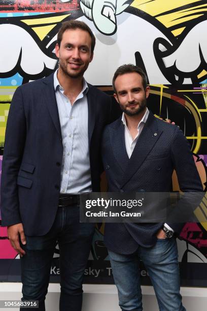 Oliver Tennant of Virgin Racing and Andrea Ferrero of Kaspersky Lab attend the unveiling of the first-ever Formula art car by Kaspersky Lab and...