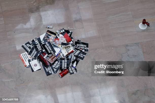 Signs from protesters opposed to Supreme Court nominee Brett Kavanaugh sit in a pile on the floor of the Hart Senate Office building in Washington,...